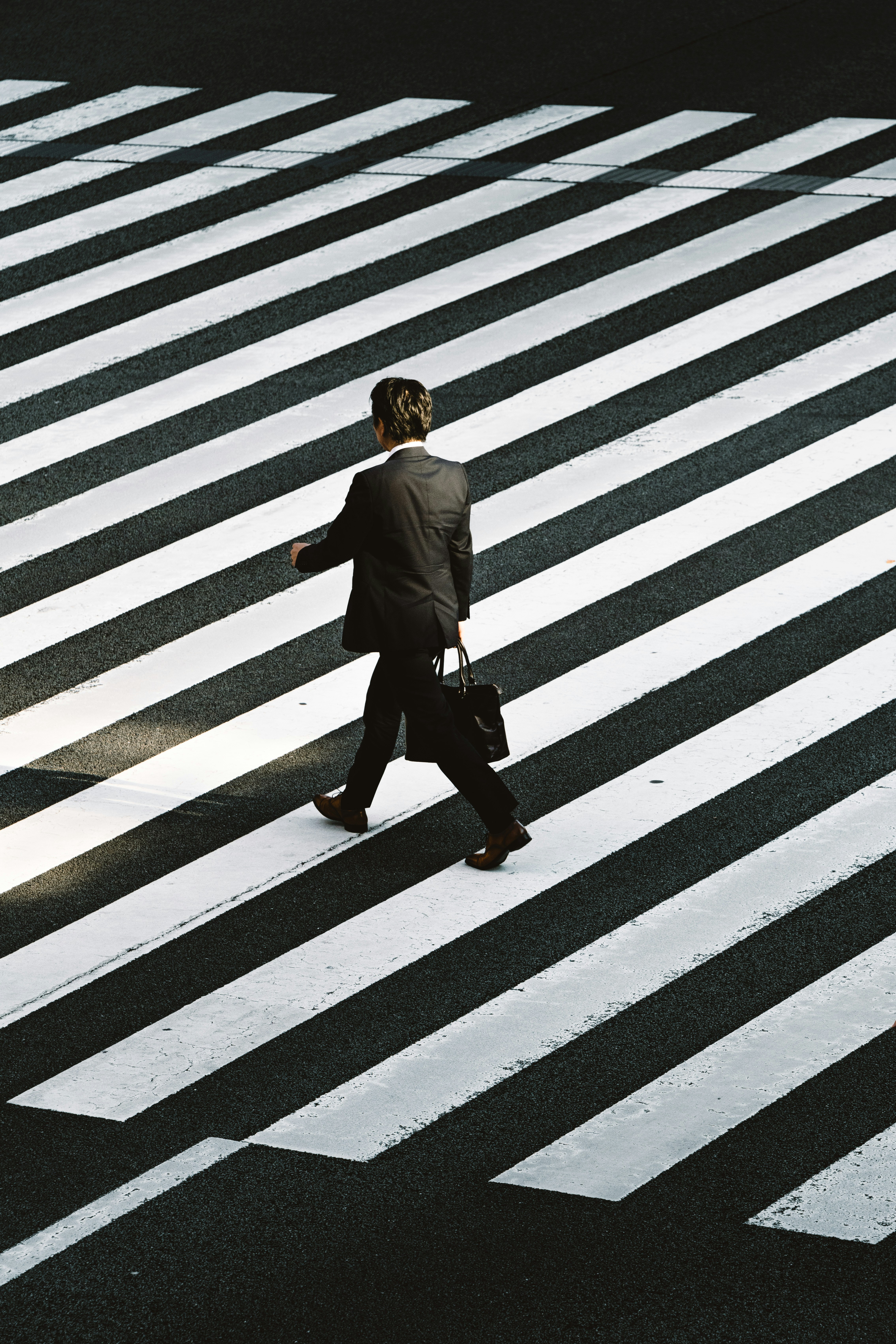 Professional crossing a city street