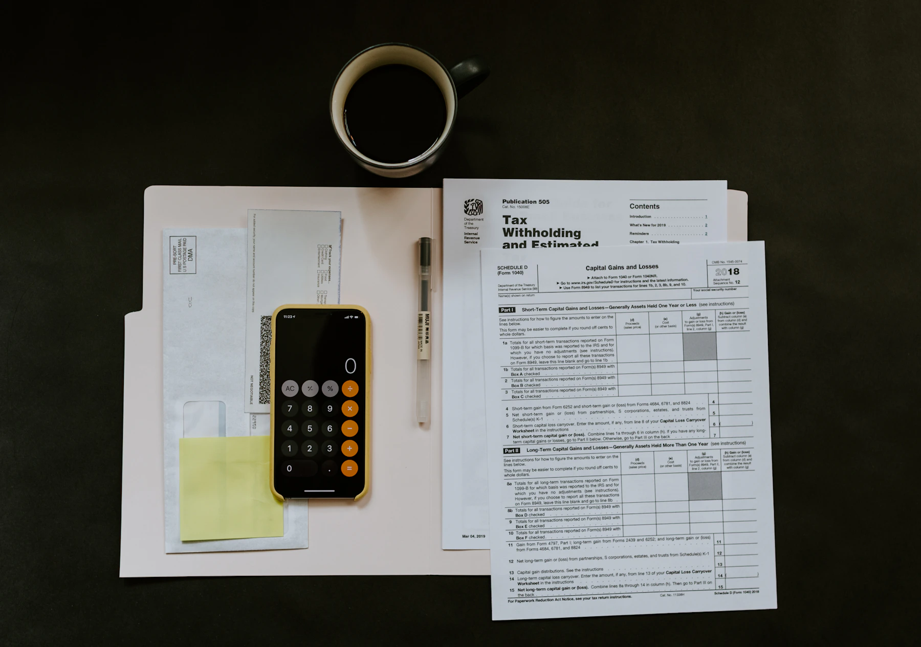 Tax and compliance documents being reviewed on a desk